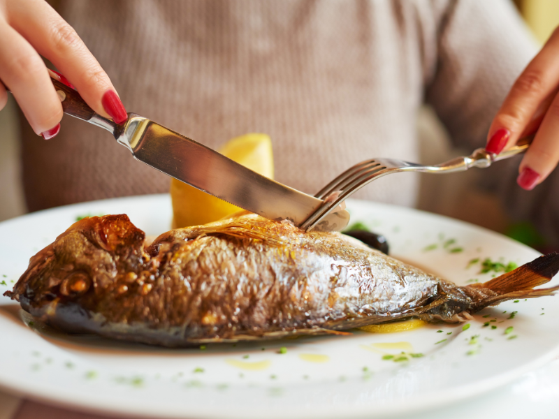 Eating fish in a restaurant