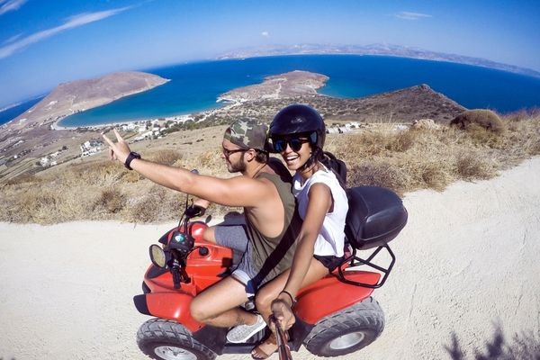 Man and a woman exploring the island and taking pictures