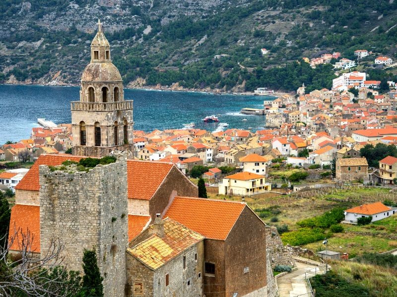 Island Vis, a view of an old bell tower and old houses