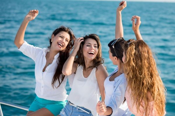 Group of girlfriends enjoying their time on a yacht
